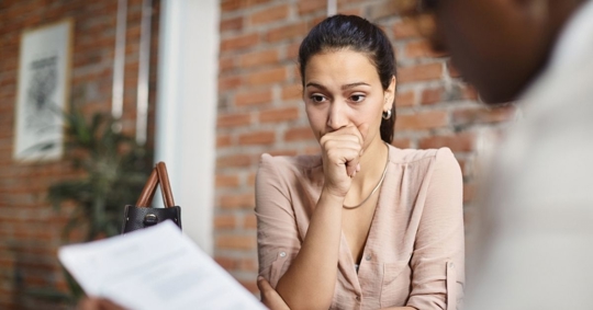 worried woman consulting with a lawyer